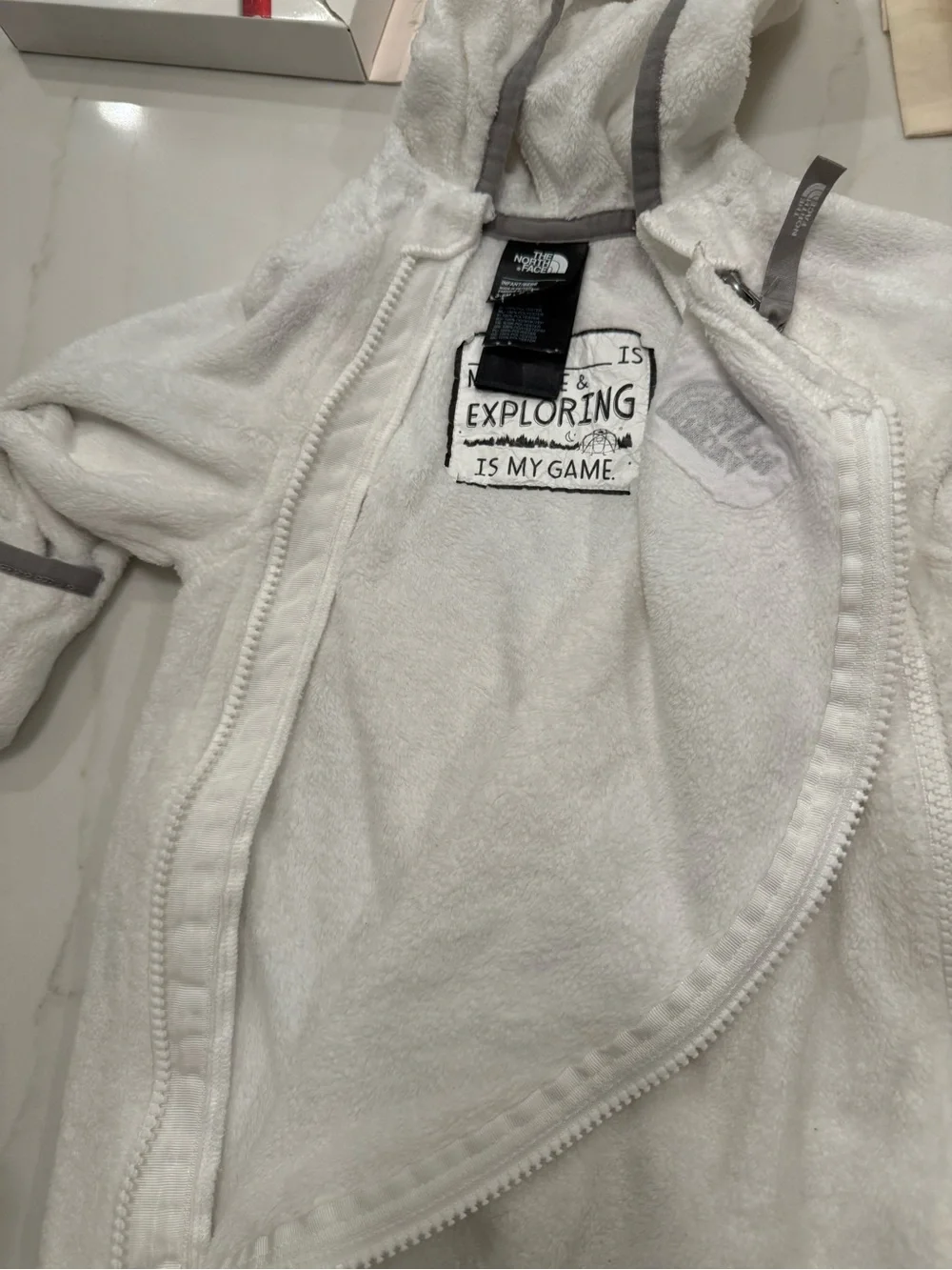 The North Face White Fleece Baby One-Piece with Gray Trim